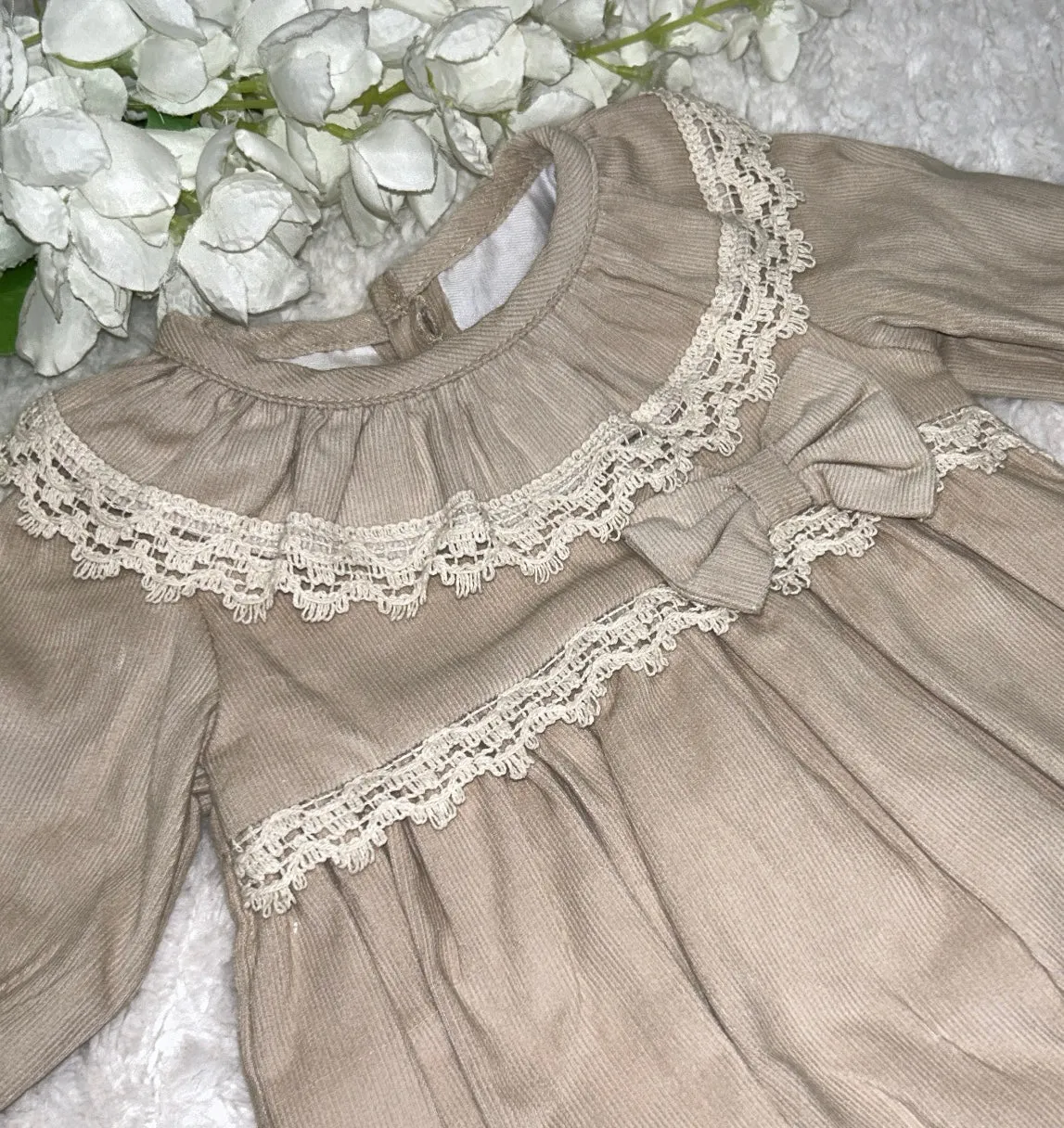 Beige long sleeved romper